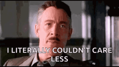A Man In A Suit And Tie Is Saying `` I Literally Couldn 'T Care Less '' GIF