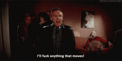 A Man In A Suit And Tie Is Saying I 'Ll Fuck Anything That Moves . GIF