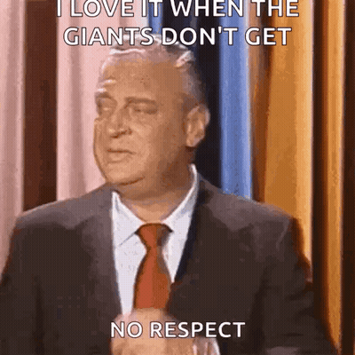 A Man In A Suit And Tie Is Saying I Love It When The Giants Don 'T Get No Respect GIF