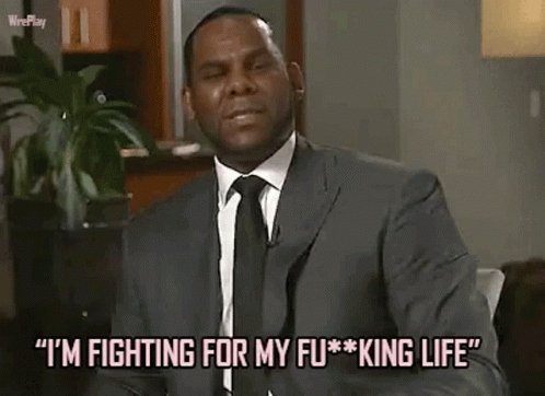 A Man In A Suit And Tie Is Saying `` I 'M Fighting For My Fu * King Life '' . GIF
