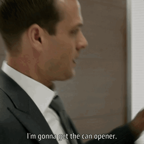 A Man In A Suit And Tie Is Saying I 'M Gonna Get The Can Opener GIF
