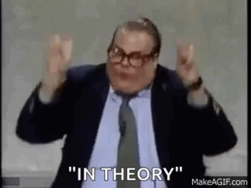 A Man In A Suit And Tie Is Saying `` In Theory '' While Giving A Speech . GIF