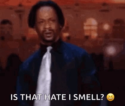 A Man In A Suit And Tie Is Saying `` Is That Hate I Smell? '' GIF