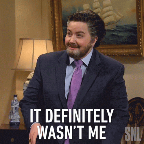 A Man In A Suit And Tie Is Saying It Definitely Wasn 'T Me GIF