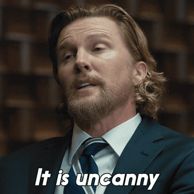 A Man In A Suit And Tie Is Saying " It Is Uncanny " GIF