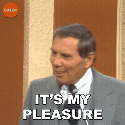 A Man In A Suit And Tie Is Saying " It 'S My Pleasure " GIF