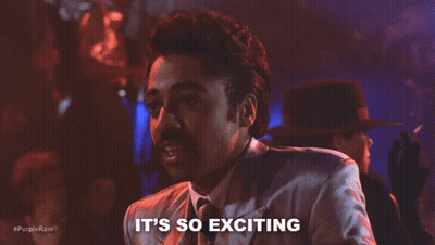 A Man In A Suit And Tie Is Saying It 'S So Exciting In A Club . GIF