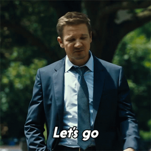 A Man In A Suit And Tie Is Saying " Let 'S Go " GIF