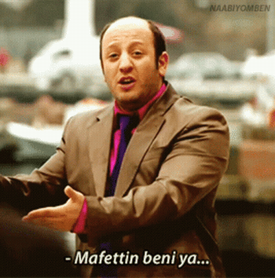 A Man In A Suit And Tie Is Saying Mafettin Beni Ya GIF
