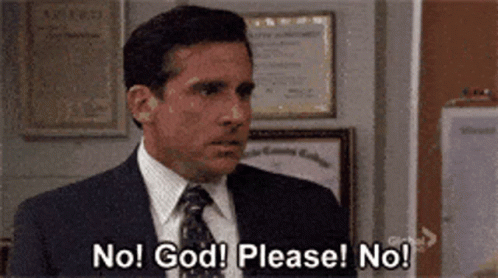 A Man In A Suit And Tie Is Saying No God Please No . GIF