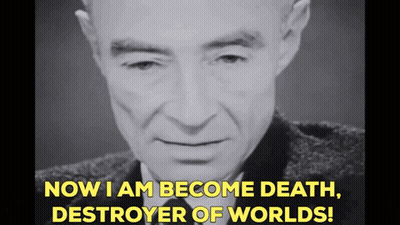 A Man In A Suit And Tie Is Saying " Now I Am Become Death Destroyer Of Worlds " GIF