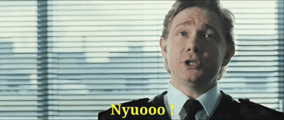 A Man In A Suit And Tie Is Saying Nyuoo GIF