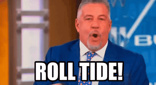 A Man In A Suit And Tie Is Saying Roll Tide ! GIF