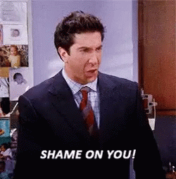 A Man In A Suit And Tie Is Saying Shame On You ! GIF