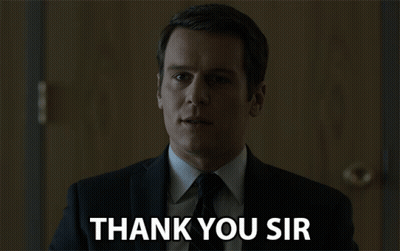 A Man In A Suit And Tie Is Saying " Thank You Sir " GIF