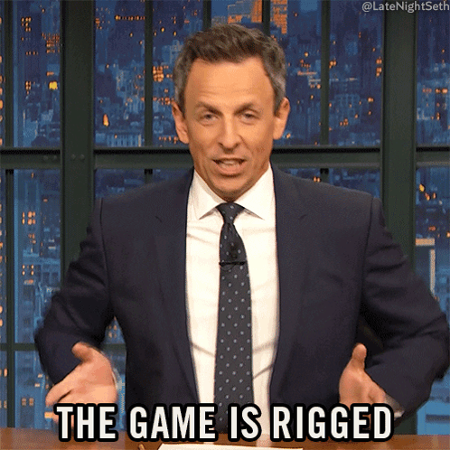 A Man In A Suit And Tie Is Saying " The Game Is Rigged " GIF