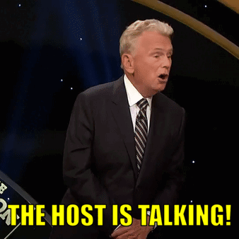 A Man In A Suit And Tie Is Saying " The Host Is Talking " GIF