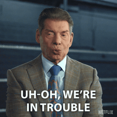A Man In A Suit And Tie Is Saying " Uh-Oh We 'Re In Trouble " GIF