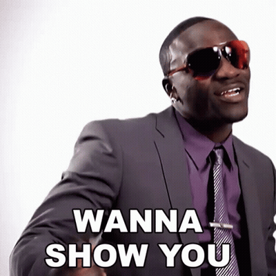 A Man In A Suit And Tie Is Saying " Wanna Show You " GIF