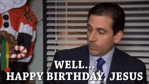 A Man In A Suit And Tie Is Saying " Well Happy Birthday Jesus " GIF