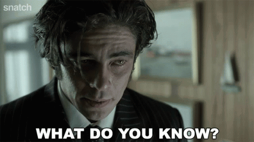A Man In A Suit And Tie Is Saying What Do You Know GIF
