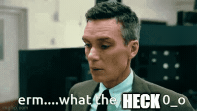 A Man In A Suit And Tie Is Saying What The Heck O GIF