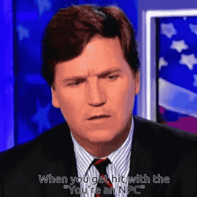 A Man In A Suit And Tie Is Saying " When You Get Hit With The " You 'Re An Npc " GIF