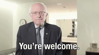 A Man In A Suit And Tie Is Saying " You 'Re Welcome " GIF