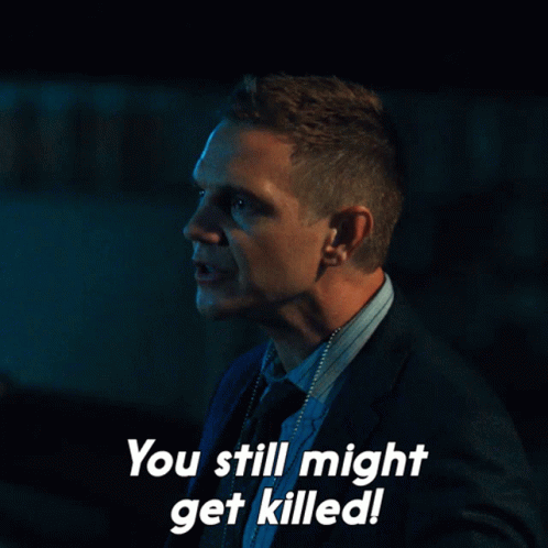 A Man In A Suit And Tie Is Saying You Still Might Get Killed GIF