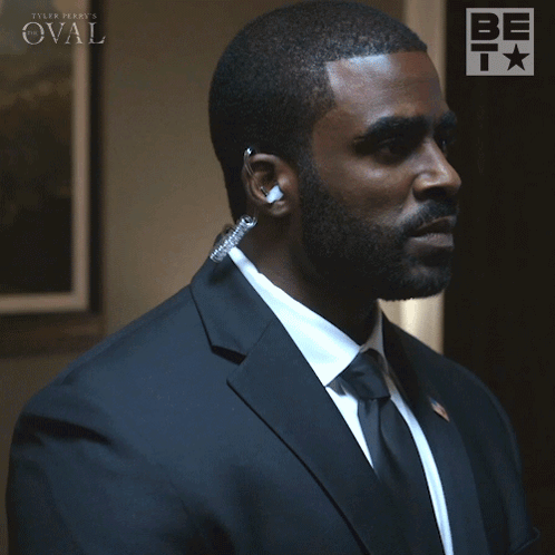 A Man In A Suit And Tie Is Saying " You Think I 'M Stupid " GIF