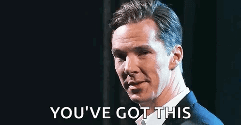 A Man In A Suit And Tie Is Saying `` You 'Ve Got This '' While Standing In Front Of A Black Background . GIF
