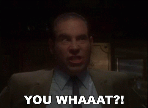 A Man In A Suit And Tie Is Saying You Whaaat ? GIF