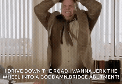 A Man In A Suit And Tie Is Screaming And Holding His Head While Saying I Drive Down The Road I Wanna GIF