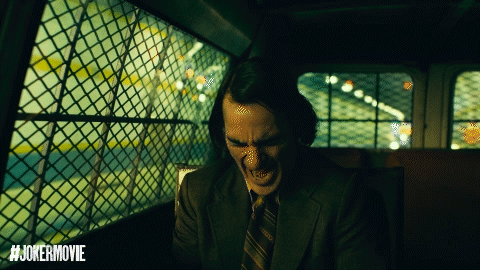 Man In Suit Screaming In Front Of Joker Movie GIF