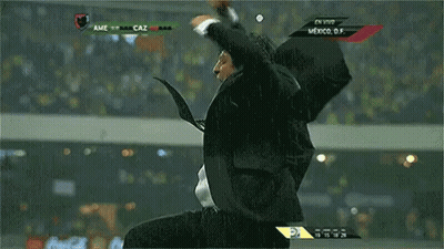 A Man In A Suit And Tie Is Screaming In Front Of A Screen That Says Mexico GIF