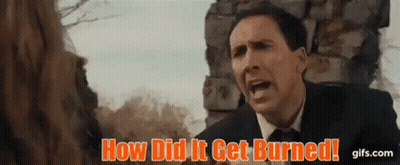 a man in a suit and tie is screaming in front of a stone wall .