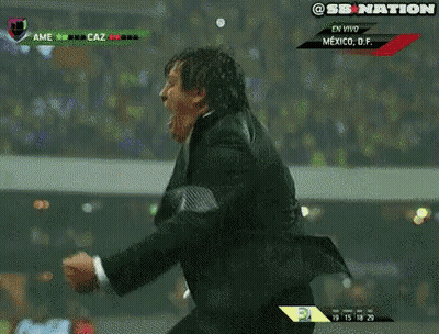 A Man In A Suit And Tie Is Screaming While Watching A Soccer Game In Mexico GIF