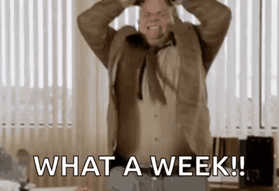 A Man In A Suit And Tie Is Screaming With His Hands On His Head And Says `` What A Week ! '' GIF