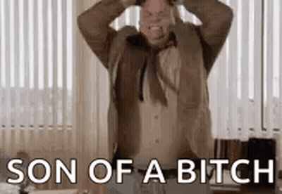 A Man In A Suit And Tie Is Screaming With His Hands On His Head And The Words `` Son Of A Bitch '' . GIF