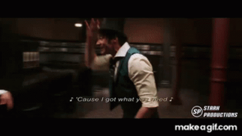 A Man In A Suit And Tie Is Singing A Song Called Cause I Got What You Need GIF