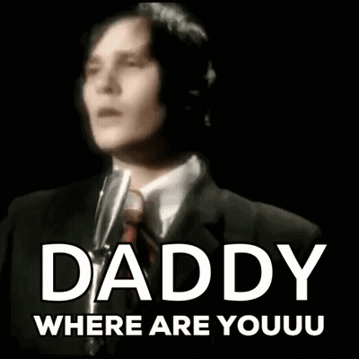 A Man In A Suit And Tie Is Singing Into A Microphone With The Words Daddy Where Are Youu Written Below Him GIF