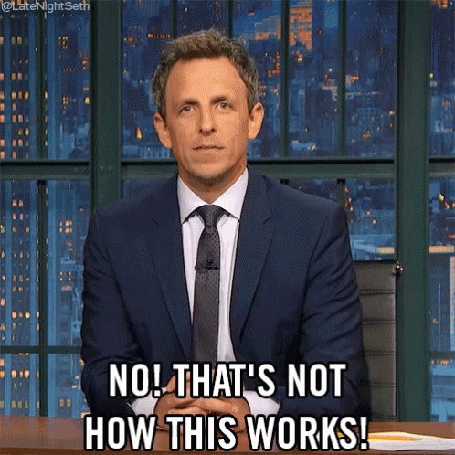 A Man In A Suit And Tie Is Sitting At A Desk And Says No That 'S Not How This Works GIF