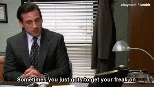 A Man In A Suit And Tie Is Sitting At A Desk And Says Sometimes You Just Got To Get Your Freak On GIF