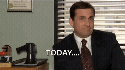 A Man In A Suit And Tie Is Sitting At A Desk In Front Of A Window And Saying Today . GIF