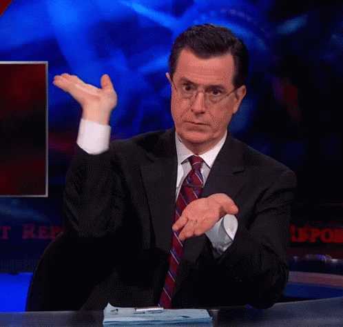 A Man In A Suit And Tie Is Sitting At A Desk With A Sign That Says ' Reports ' GIF