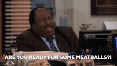 A Man In A Suit And Tie Is Sitting At A Desk With Stuffed Animals And Says Are You Ready For Some Meatballs ? GIF
