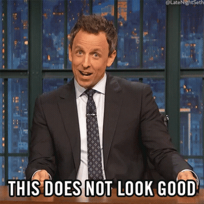 A Man In A Suit And Tie Is Sitting At A Table And Says This Does Not Look Good GIF