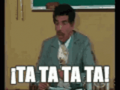 A Man In A Suit And Tie Is Sitting At A Table With A Plate Of Food And A Glass Of Water . GIF