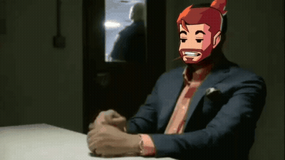 A Man In A Suit And Tie Is Sitting At A Table With His Hands Folded And Smoking A Cigarette . GIF