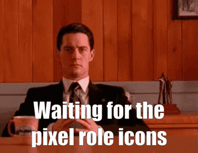A Man In A Suit And Tie Is Sitting At A Table With The Words " Waiting For The Pixel Role Icons " Below Him GIF